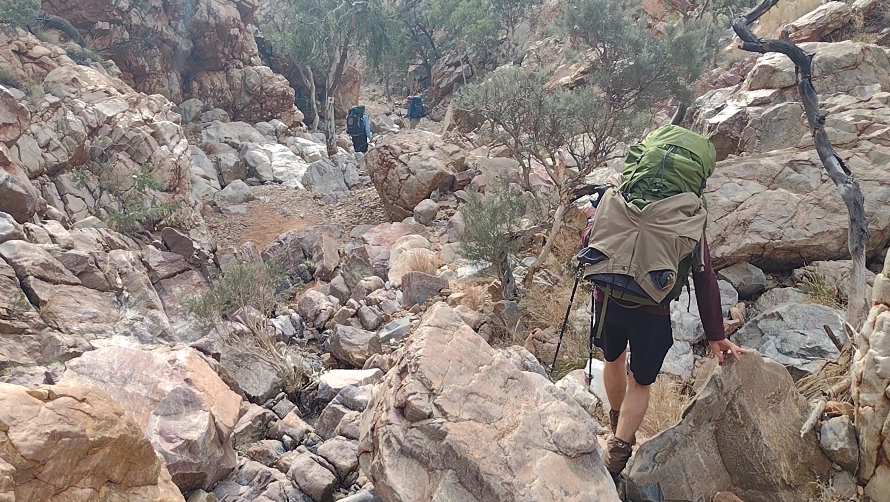 Spring Gap. Phil with trousers rigged across the back of his pack to dry after washing them at Ellery Creek.