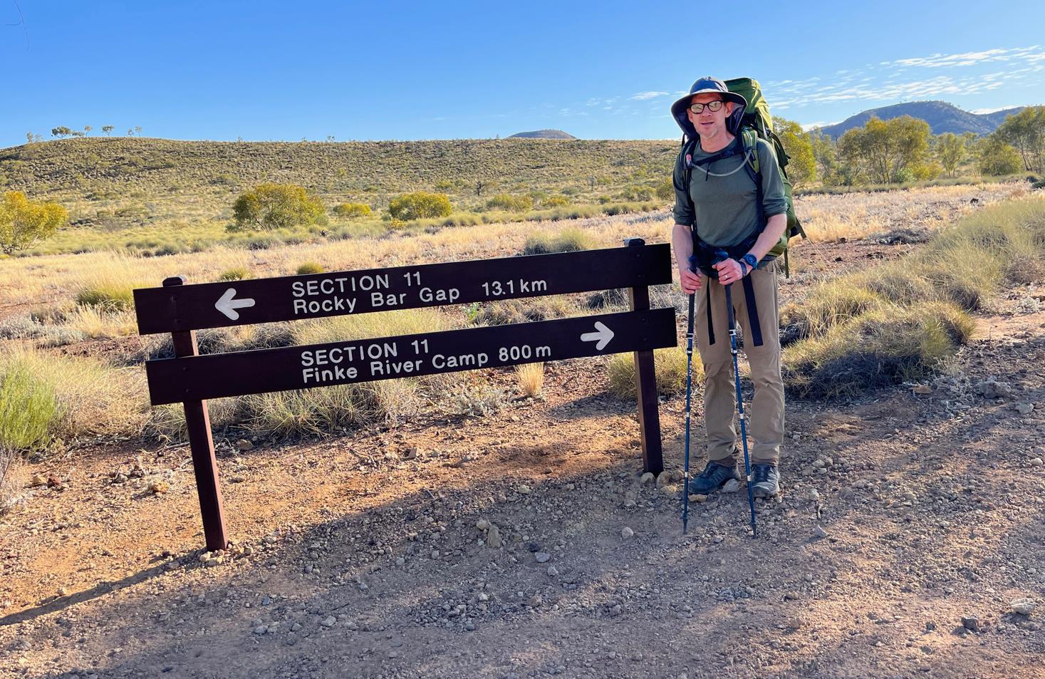 The junction to Glen Helen Gorge just beyond Finke River. One regular sized Phil for scale.