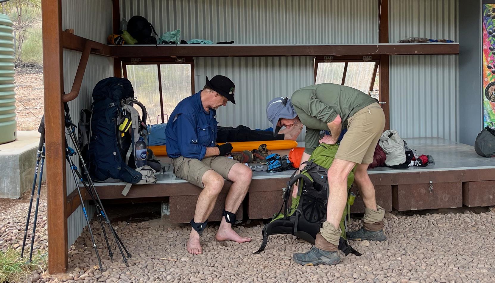 Phil and I sorting gear at the trail head shelter. Frase sacked out on his mattress in the background.