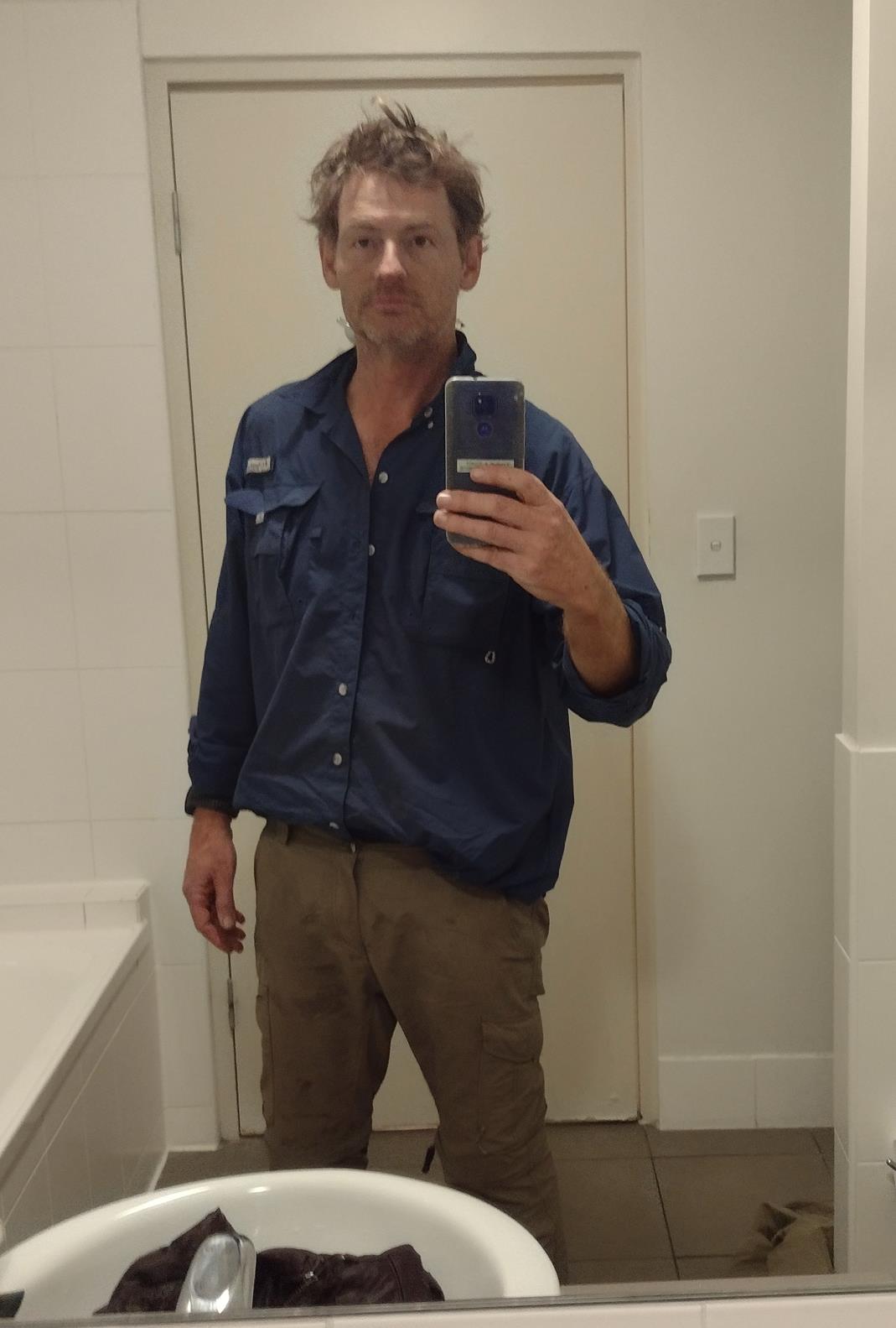 Hotel bathroom selfie. Two weeks without a shower, or a change of clothes. Filthy. Disheveled. Gaunt.